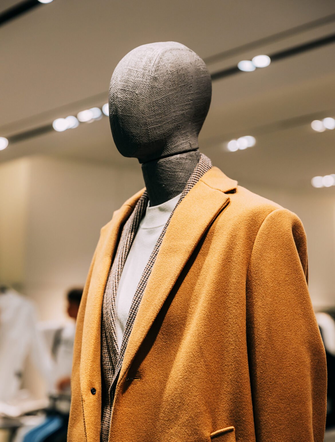 Mannequin Dressed In Men male Casual Clothes And coat jacket Clothes In Store Of Shopping Center. Store Of Shopping Center. display in shop mall store. Store Of Shopping Center. retail sale.
